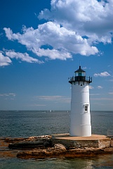 Puffy Cumulus Clouds Over Portsmouth Lighthouse Tower